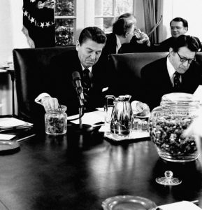 Ronald Reagan enjoying jelly-beans in the Oval office